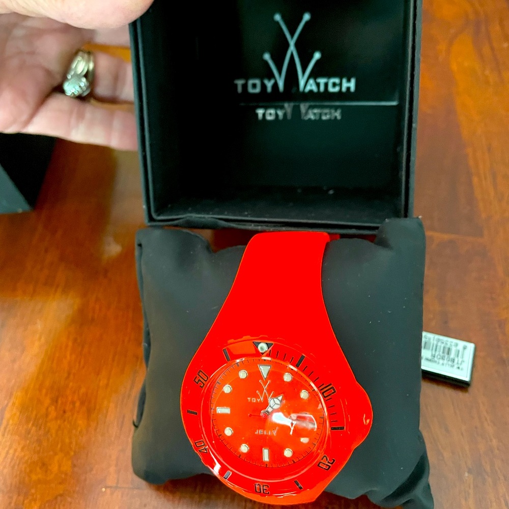 New authentic toy watch, orange which retails at $250.